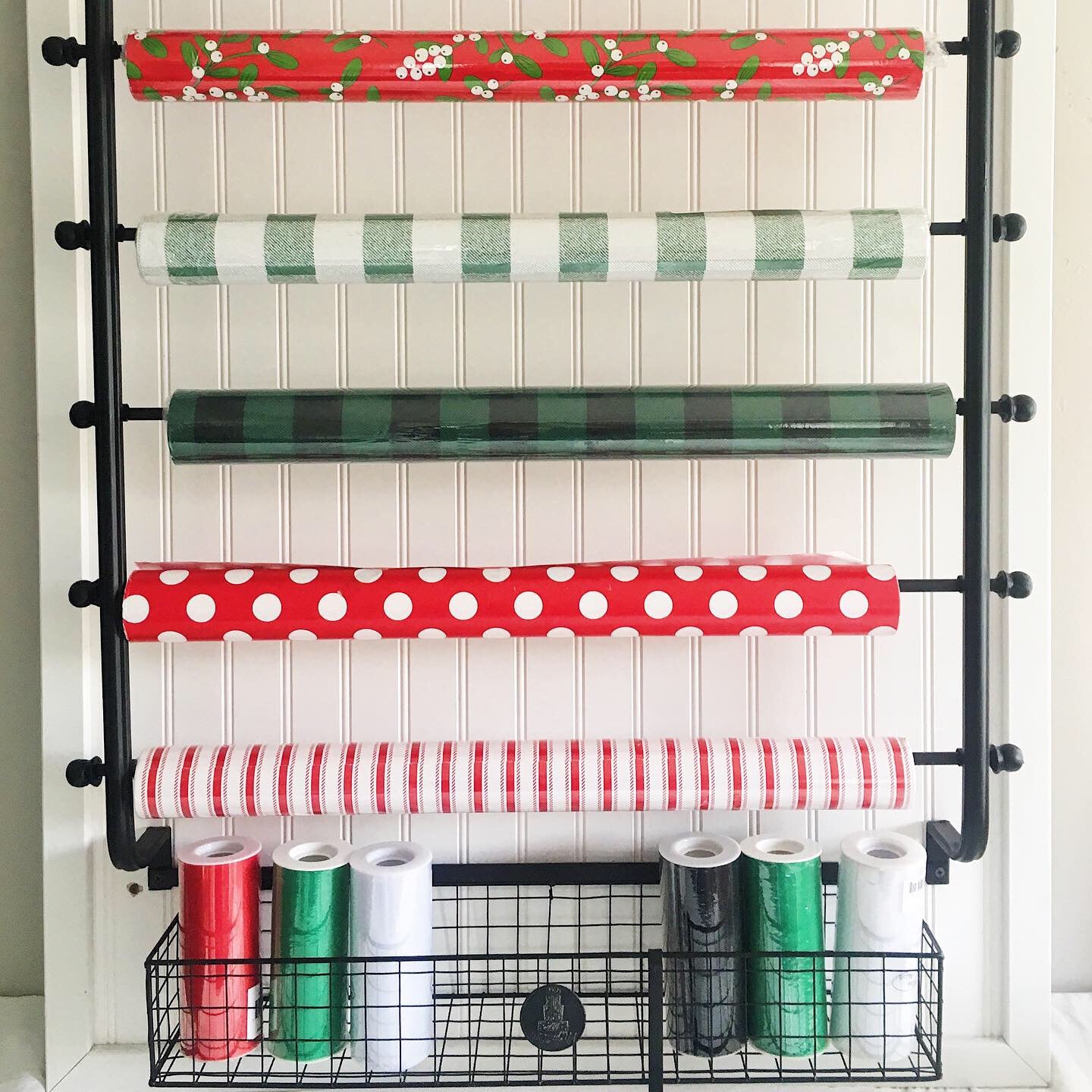 My new pantry shelves lined with wrapping paper from Michaels ($1.50 per  roll) covered in clear adhesi…